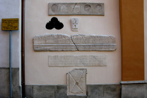 Historical bas-reliefs on the facade of Santa Marta at Menaggio